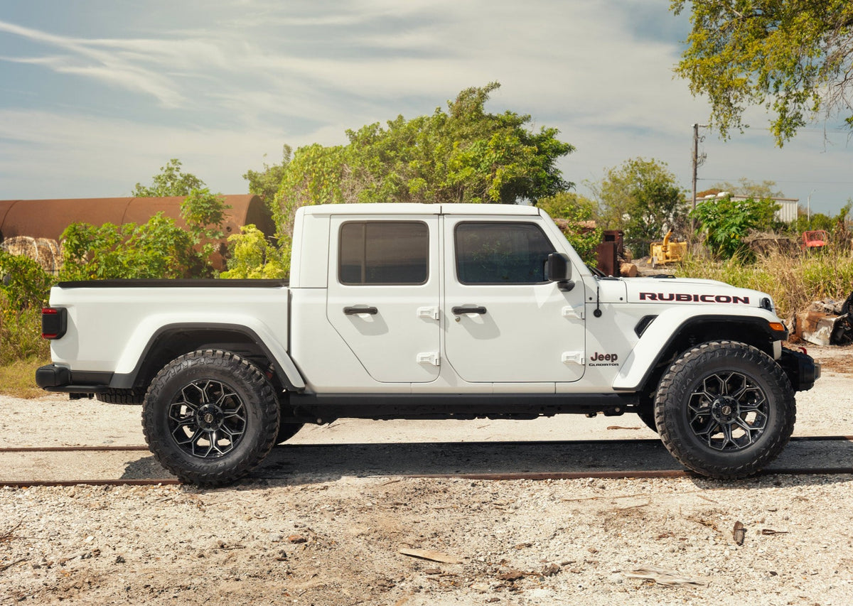 SET OF 4 WHEEL & TIRE PACKAGE | 4Play 4P83 20x10 -18 5x127/5x139.7 Gloss Black | 33x12.50R20 SureTrac Wide Climber R/T I